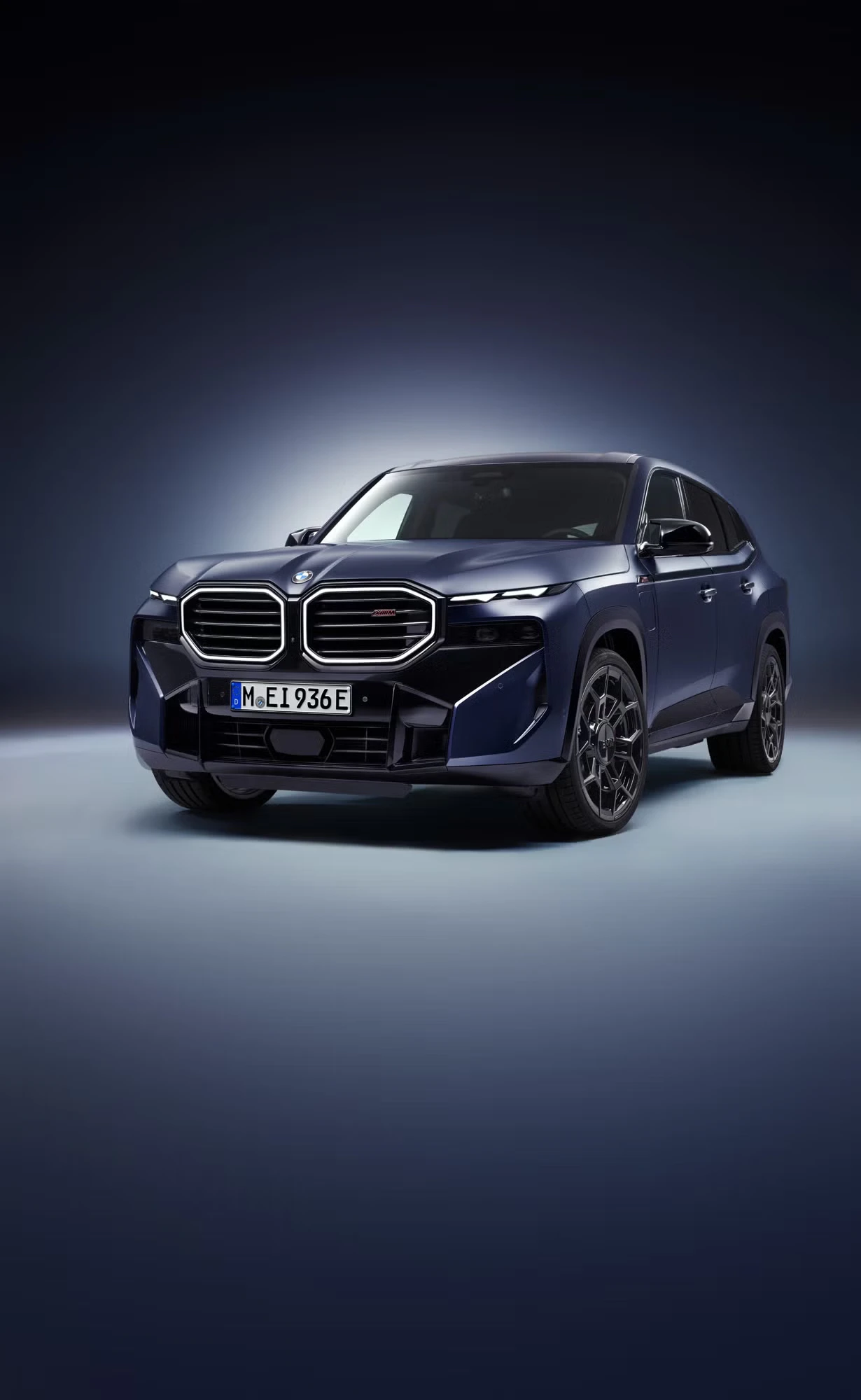 2026 BMW XM luxury electric SUV with distinctive dual kidney grille in metallic blue