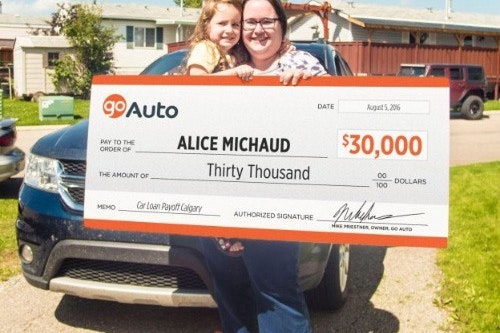 Photo of contest winner Alice Michaud holding cheque