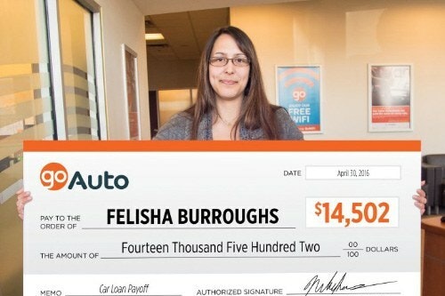 Photo of contest winner Felisha Burroughs holding cheque