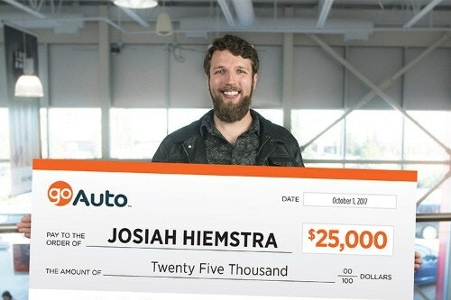 Photo of contest winner Josiah Hiemstra holding cheque