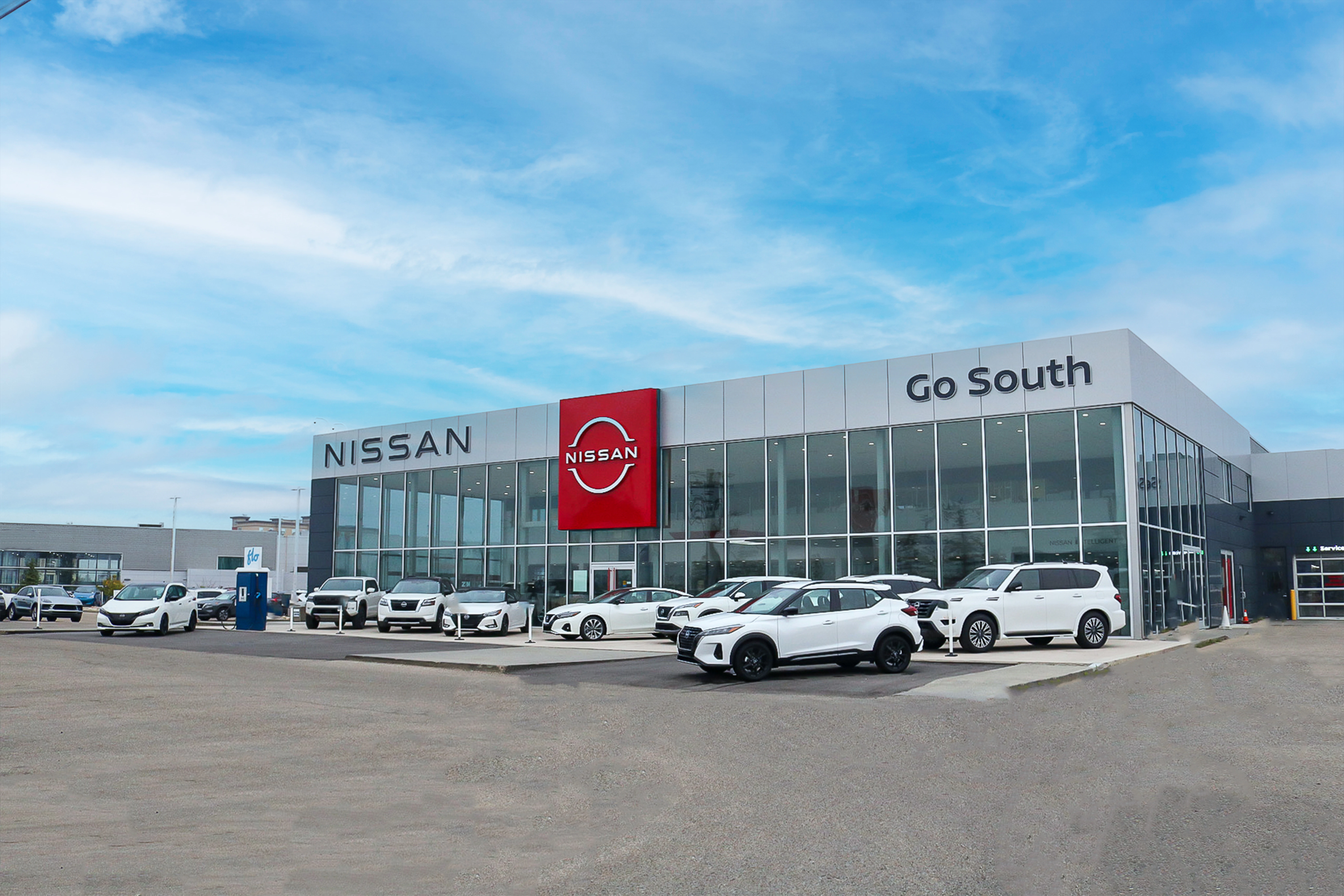 Go South Nissan dealership exterior with Nissan vehicles displayed in lot