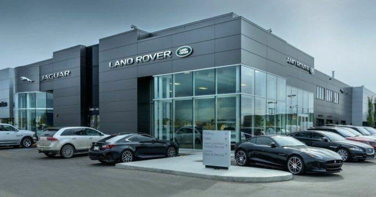 Jaguar Land Rover dealership exterior with vehicles on display lot