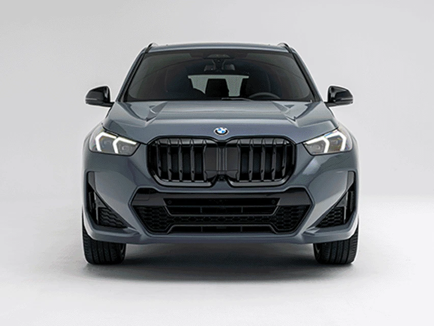 GIF showcasing multiple exterior views and features of a grey 2026 BMW X1 xDrive28i, including front, side and rear angles on a white studio background.