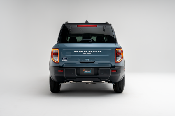 Rear view of a 2026 Ford Bronco Outer Banks showing taillights, Bronco badging, and bumper.