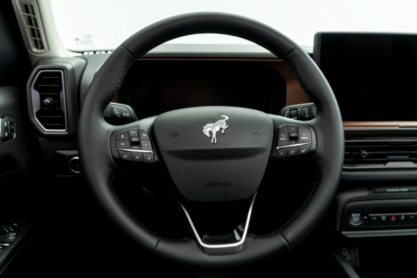 2026 Ford Bronco Outer Banks steering wheel with driver controls.