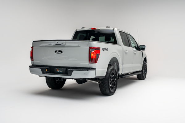 2026 Ford F-150 XLT white pickup truck rear three-quarter view