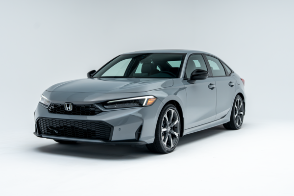 Front three-quarter view of a grey 2026 Honda Civic showing LED headlights, grille and alloy wheels.