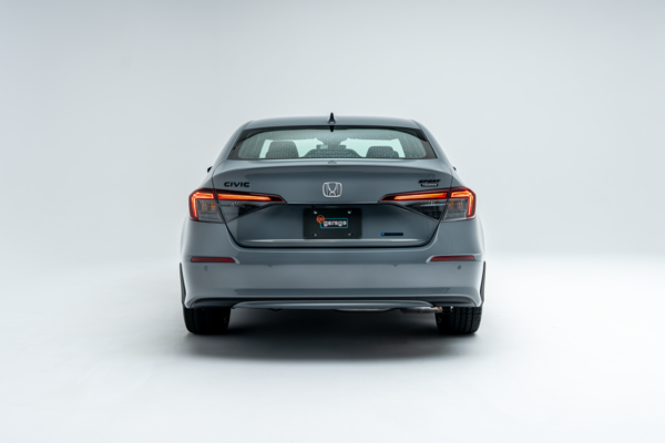 Rear view of a grey 2026 Honda Civic showing LED taillights and sedan design.