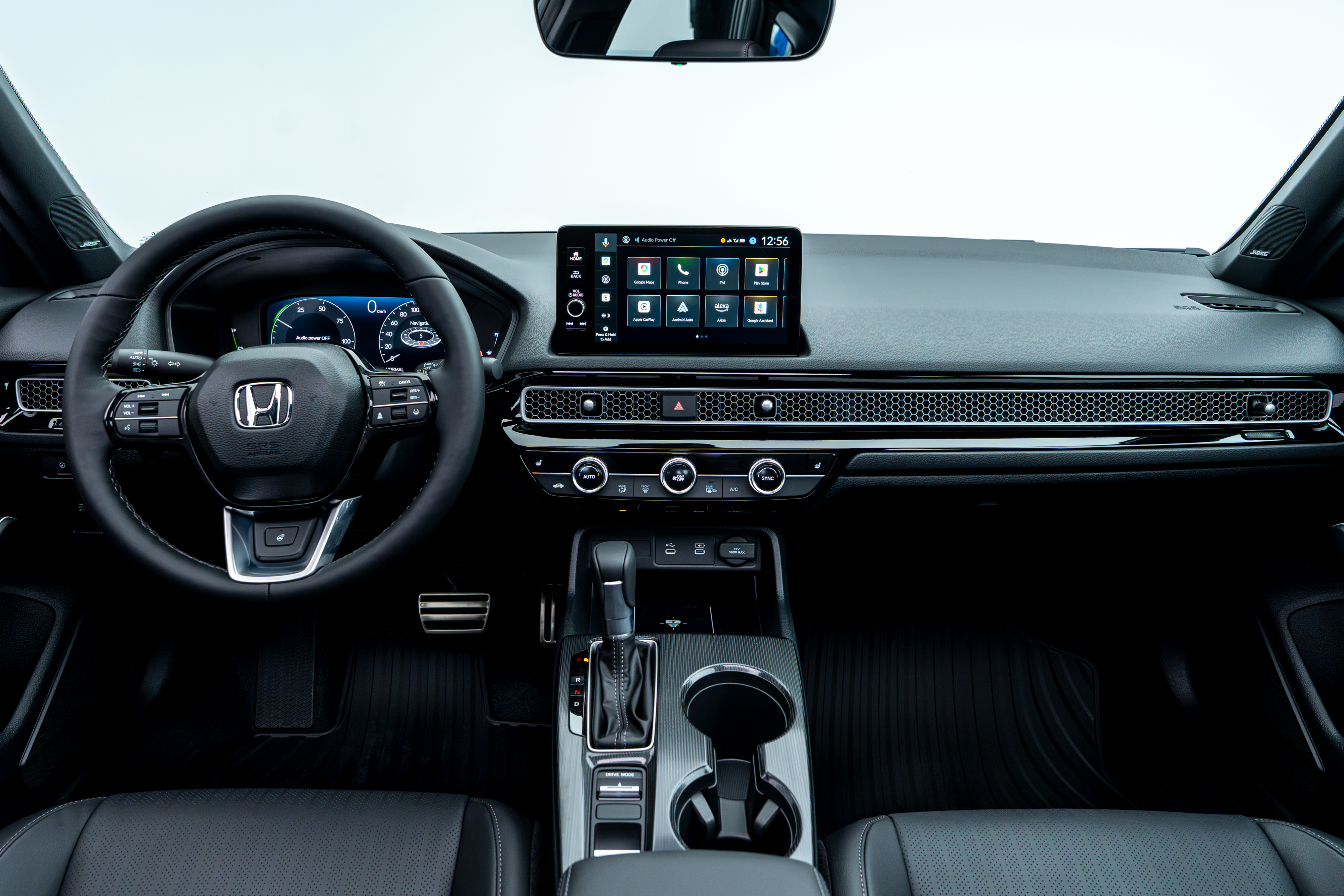 2026 Honda Civic interior with digital display, touchscreen, steering wheel and centre console.