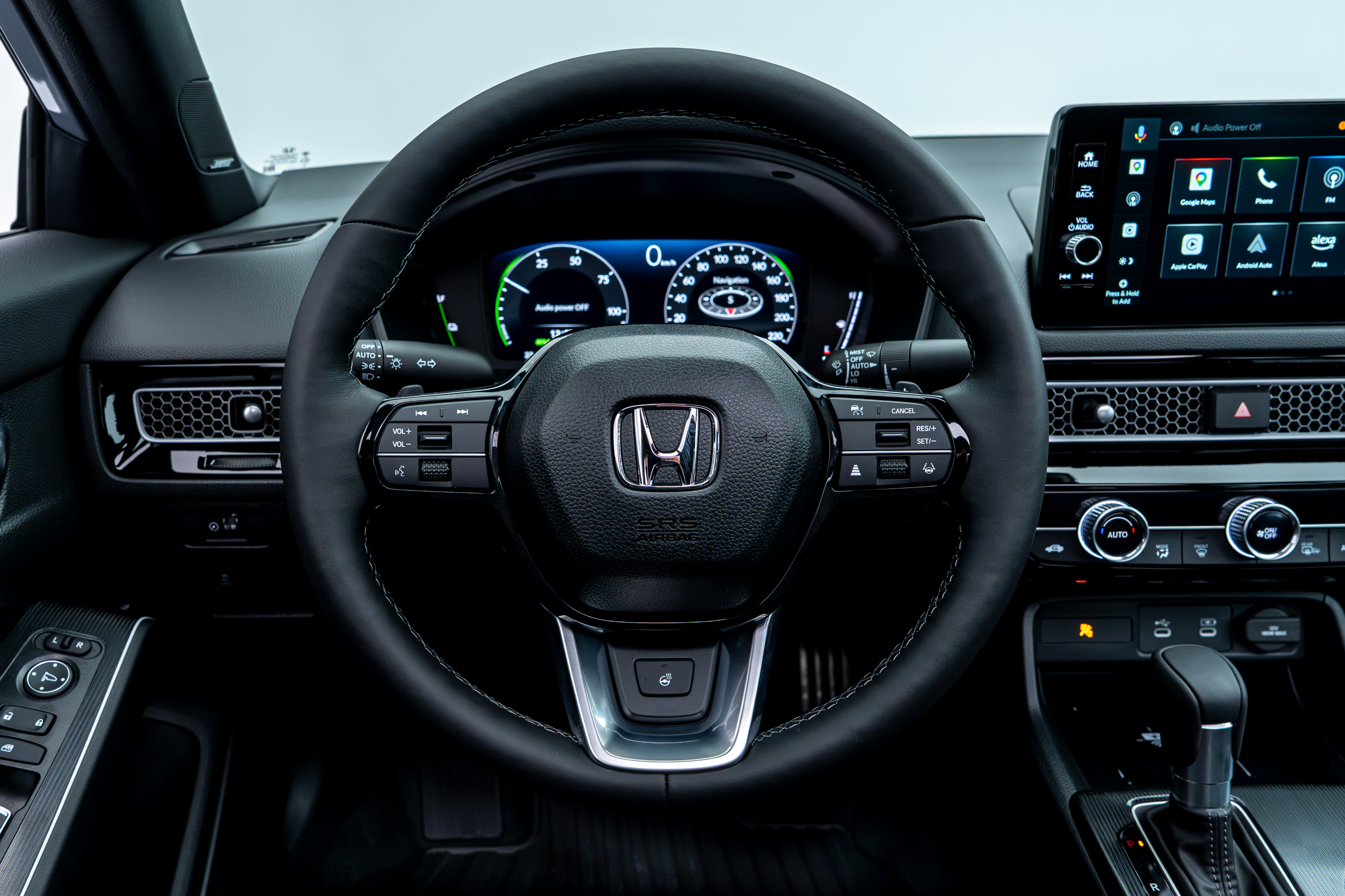 2026 Honda Civic driver view featuring the steering wheel, digital gauge cluster and touchscreen display.