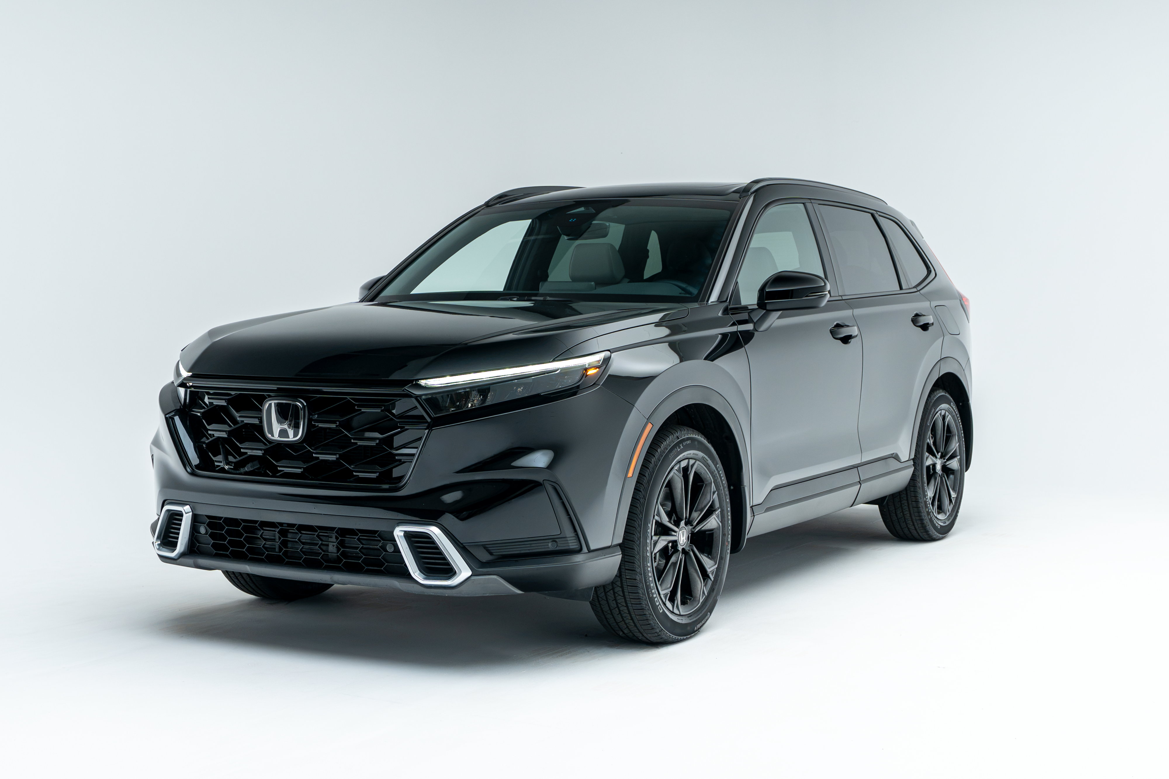 Front three-quarter view of a black 2026 Honda CR-V SUV on a white studio background.