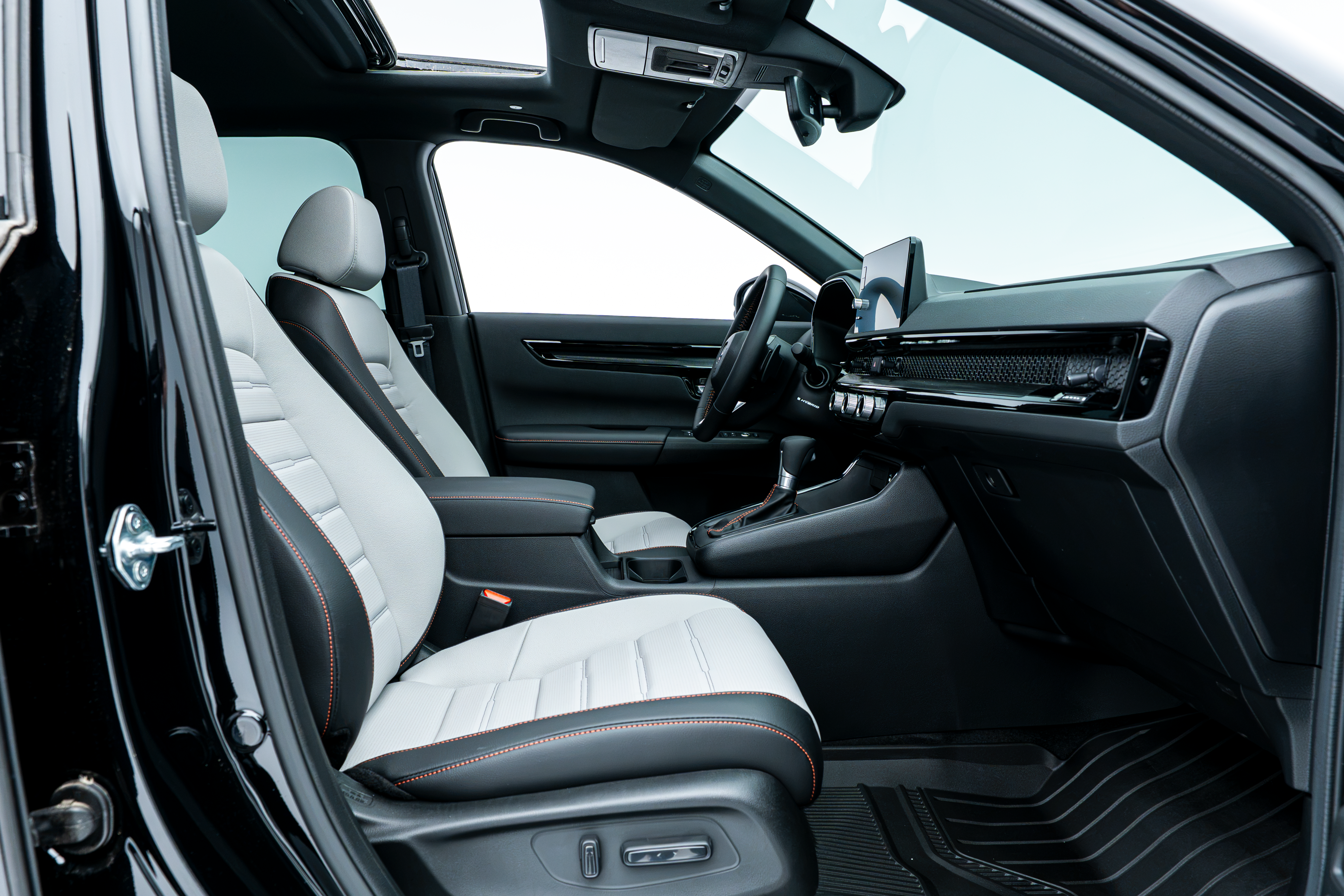 2026 Honda CR-V front interior with two-tone seats, dashboard, centre console and sunroof.