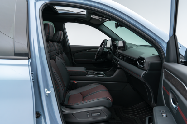 2026 Honda Pilot front interior with seats, dashboard, centre console and infotainment display.