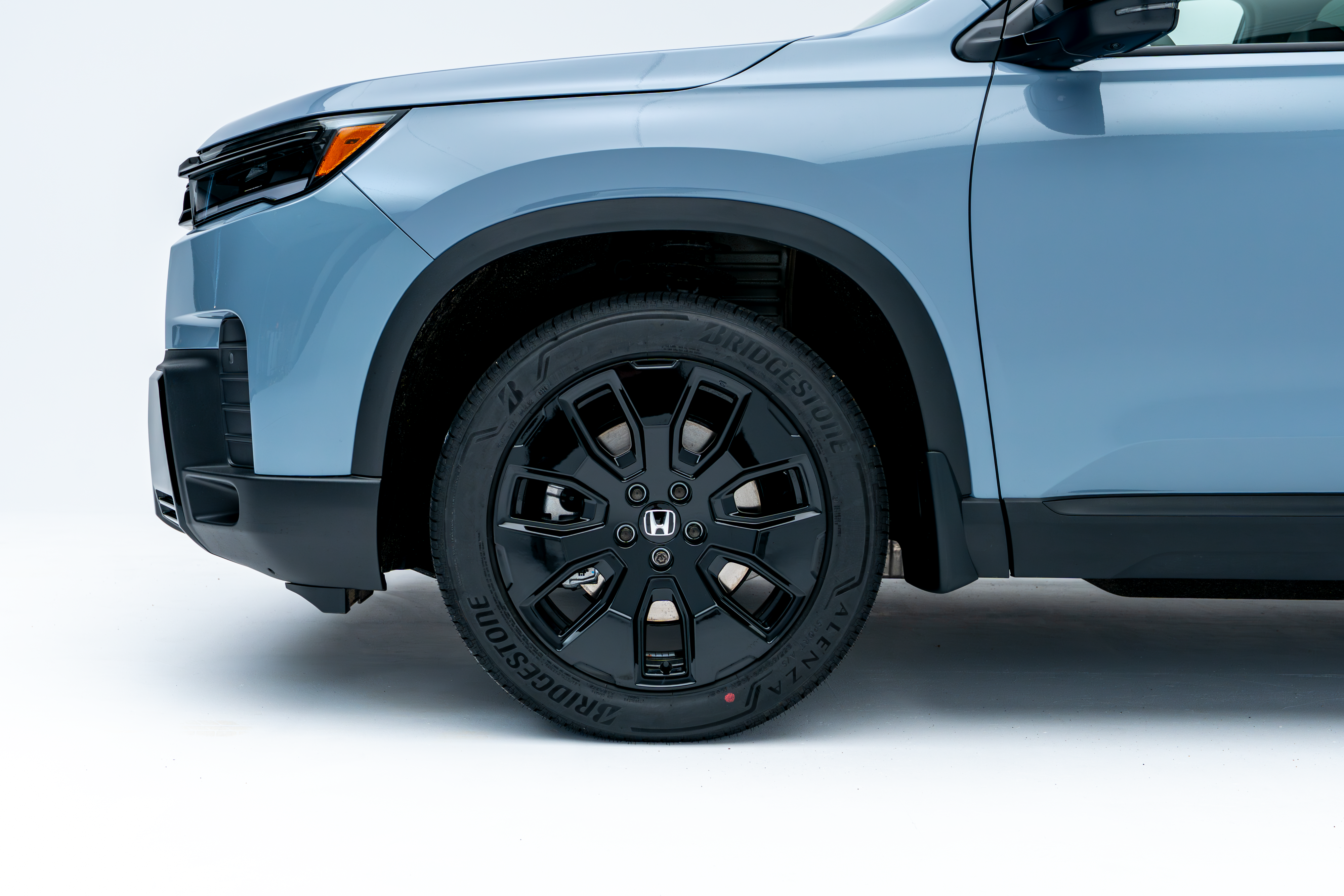 2026 Honda Pilot front quarter panel and wheel detail view