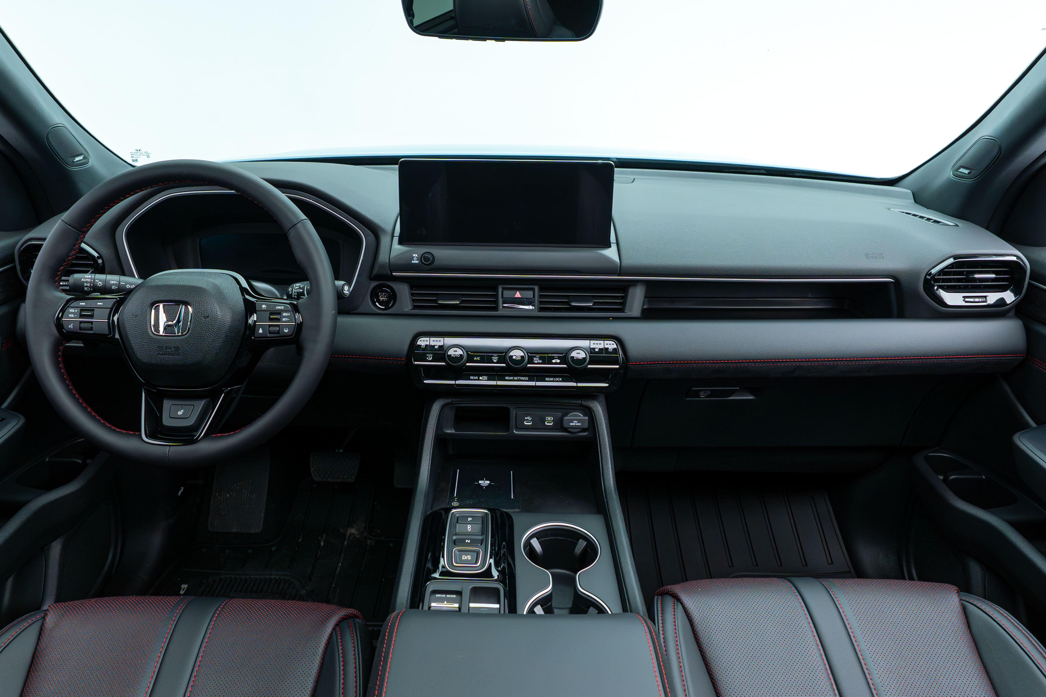 2026 Honda Pilot dashboard and front interior with steering wheel and infotainment display