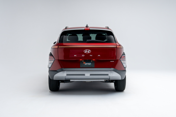 Rear view of a red 2026 Hyundai Kona showing LED taillights, Kona badging and compact SUV design.