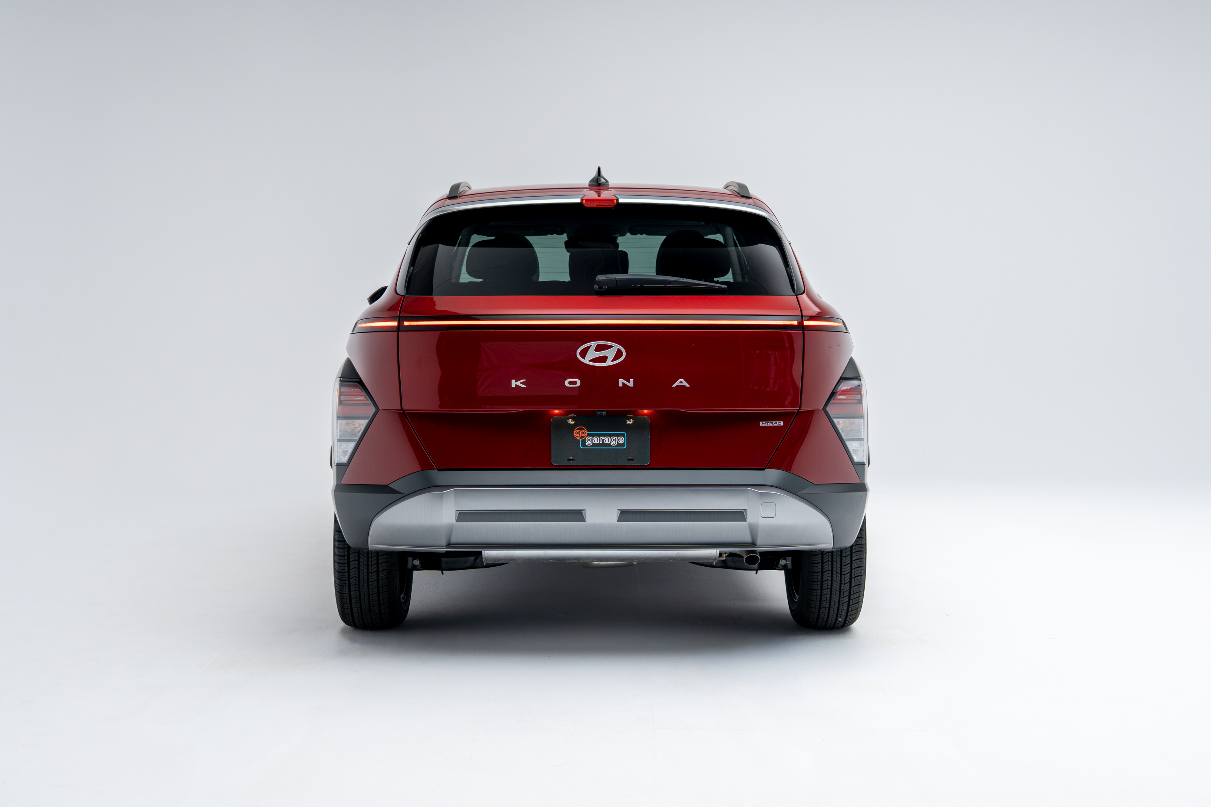 Rear view of a red 2026 Hyundai Kona showing LED taillights, Kona badging and compact SUV design.