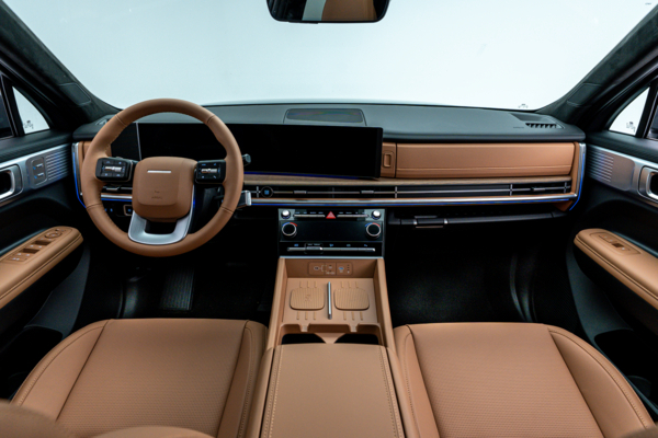 2026 Hyundai Santa Fe Hybrid interior with tan seats, panoramic display, steering wheel and centre console