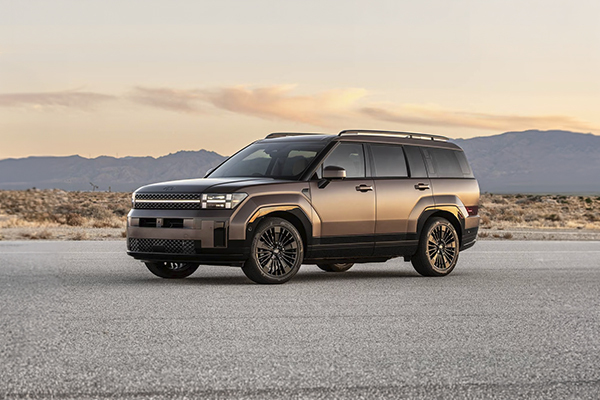 Hyundai Santa Fe SUV parked in desert landscape at sunset