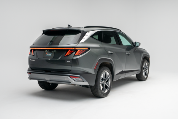 2026 Hyundai Tucson in grey, shown from a rear three-quarter angle against a white studio background.