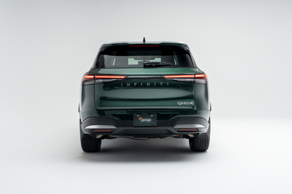 Rear view of a 2026 Infiniti QX60 showing LED taillights, QX60 badging and rear bumper.