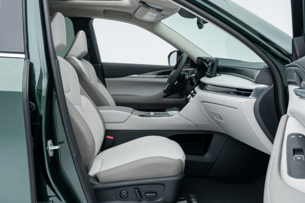 2026 Infiniti QX60 front interior with seats, dashboard, centre console and infotainment display.
