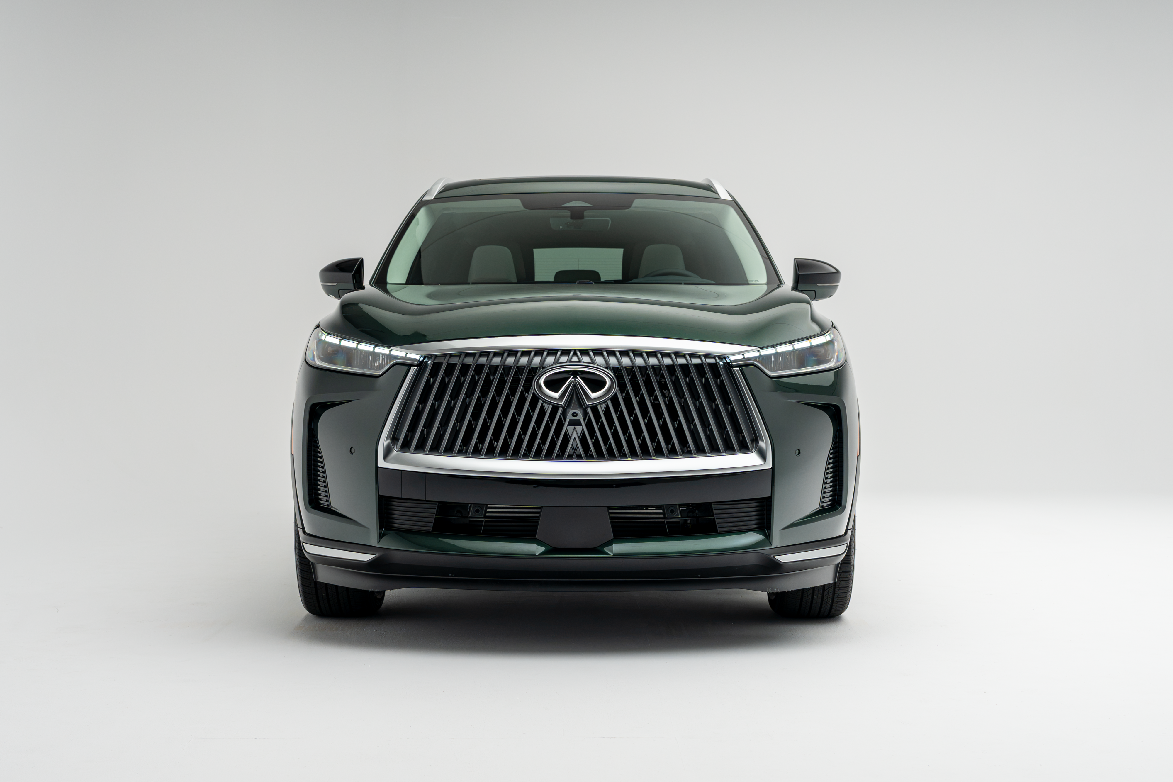 Front view of a 2026 Infiniti QX60 showing LED headlights, grille and front fascia.