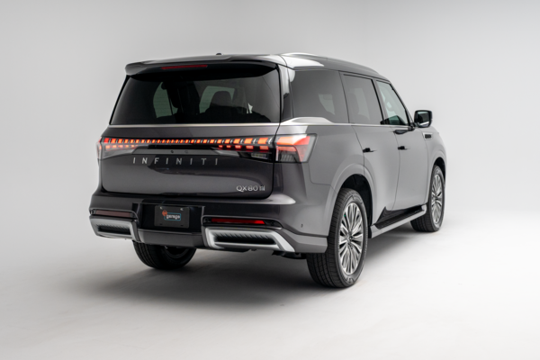 2027 INFINITI QX80 LUXE rear three-quarter exterior view with LED taillights