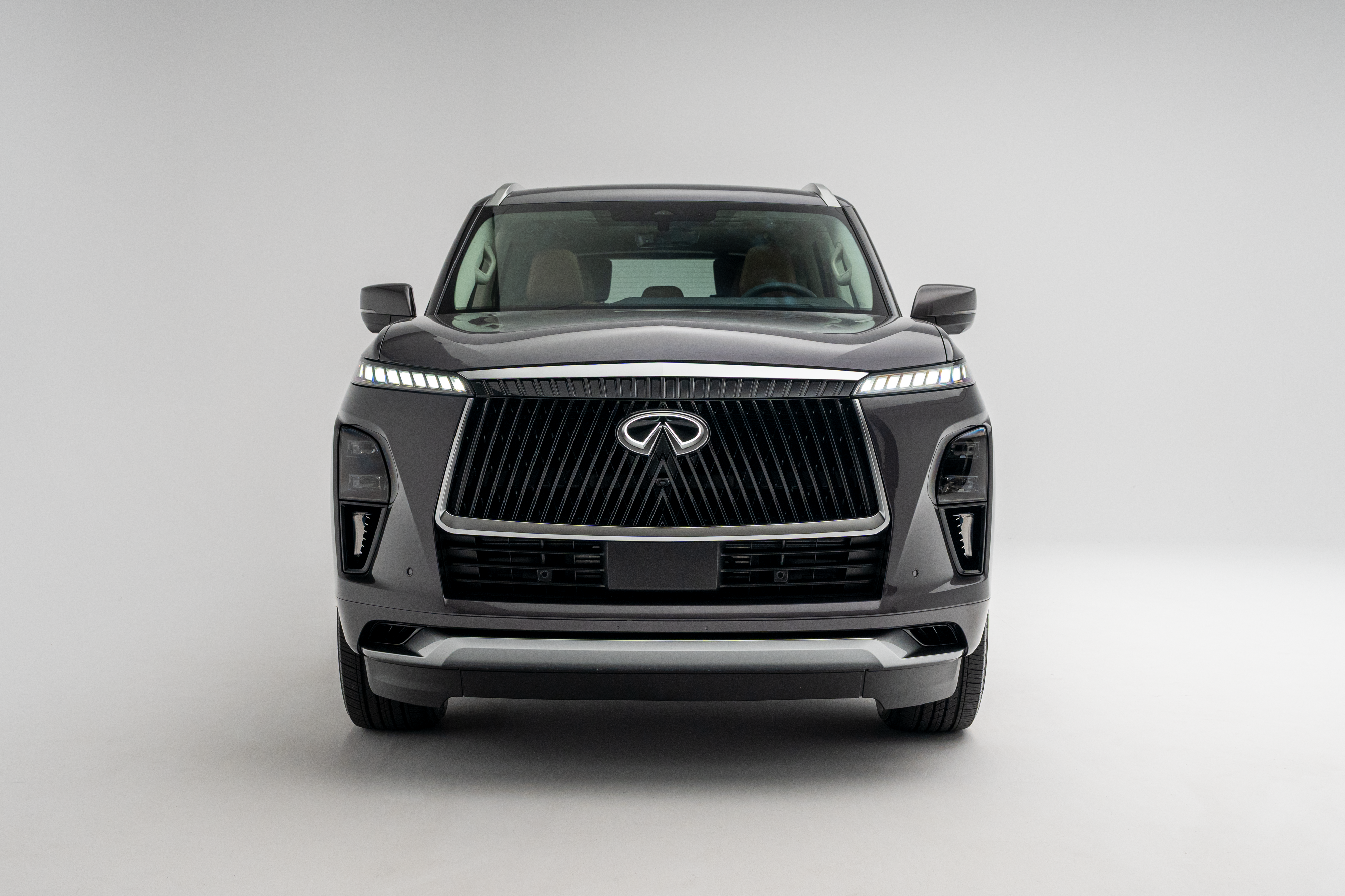 2027 INFINITI QX80 LUXE front exterior view with signature grille and LED headlights