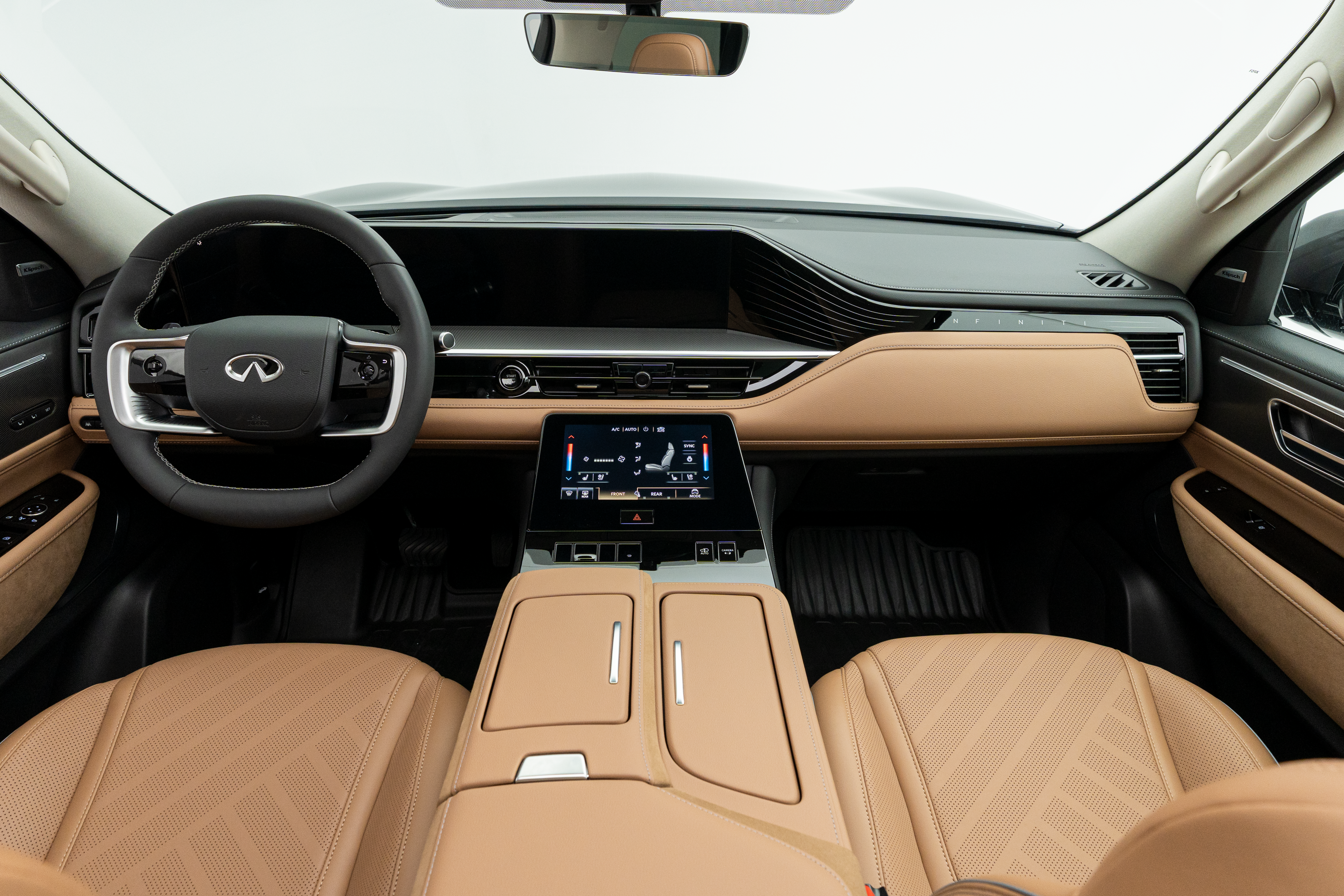 2027 INFINITI QX80 LUXE front interior with dashboard, displays and centre touchscreen