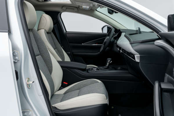 2026 Mazda CX-30 front interior with two-tone seats, dashboard, centre console and sunroof.