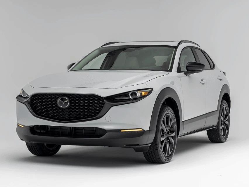 2026 Mazda CX-30 GS in white, front three-quarter view on neutral background