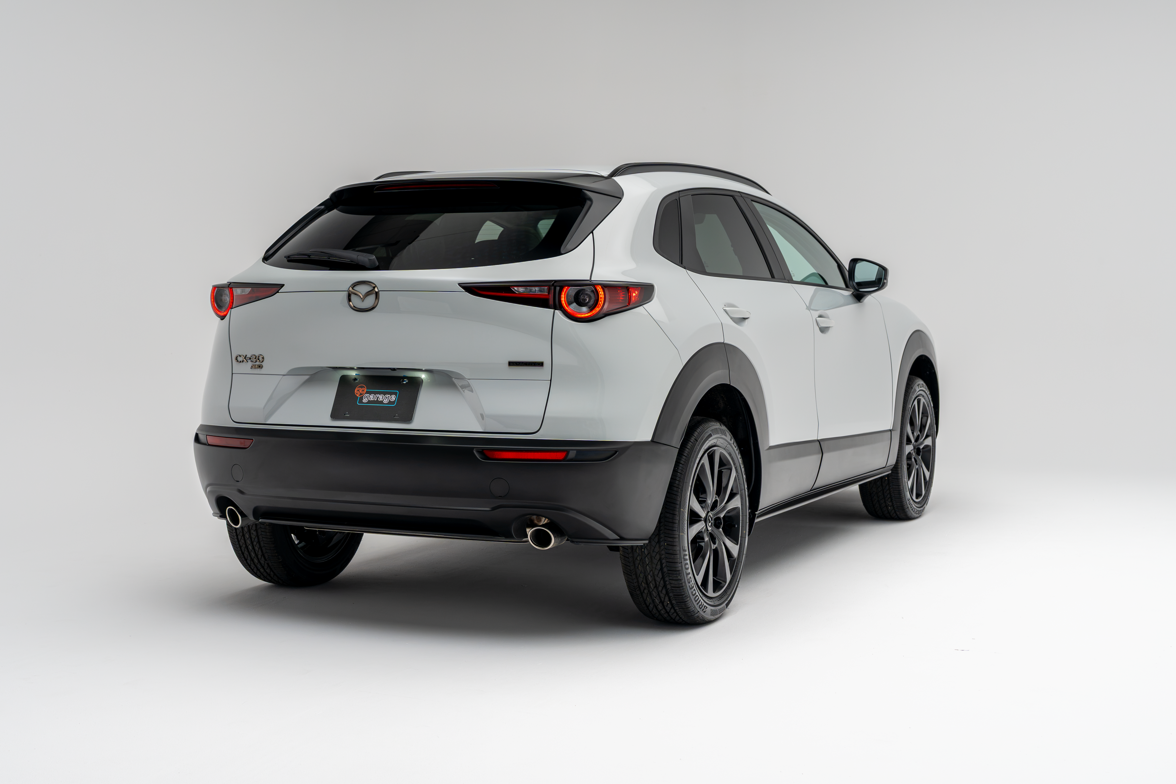 2026 Mazda CX-30 GS in white shown from rear three-quarter view
