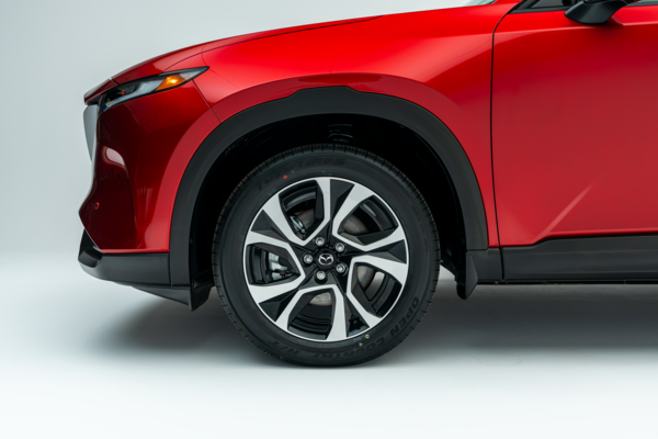 2026 Mazda CX-5 GS front quarter panel and wheel detail in red