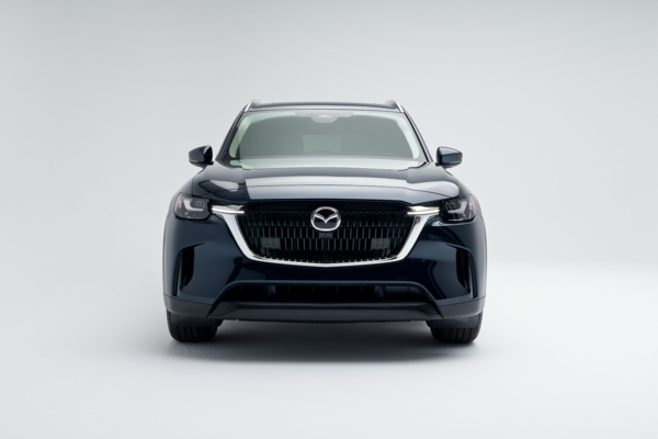 Front view of a blue 2026 Mazda CX-90 showing LED headlights, grille and front fascia.