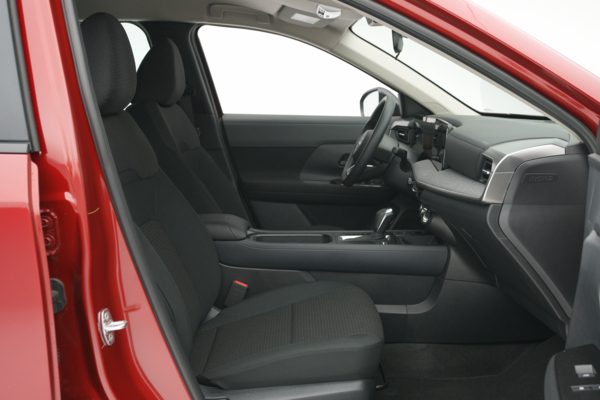 2026 Nissan Kicks front interior with black seats, dashboard, centre console and digital displays.