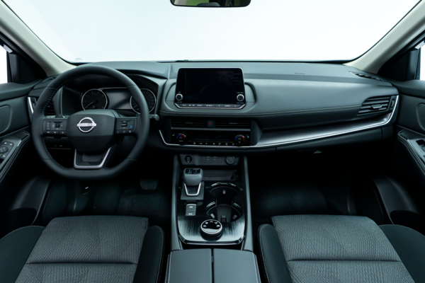Nissan Rogue SV Moonroof interior dashboard with steering wheel, infotainment display, centre console and front seats.