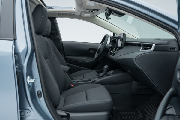 2026 Toyota Corolla front interior with seats, dashboard, centre console and infotainment display.