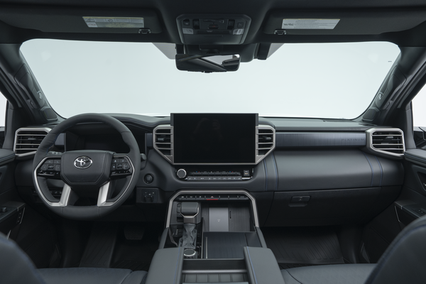 2026 Toyota Tundra interior dashboard with steering wheel, infotainment display, centre console and front seats.