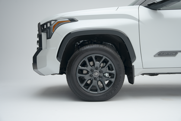 Close-up of a 2026 Toyota Tundra alloy wheel, tire and front fender.