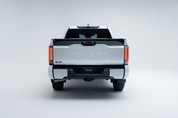 Rear view of a 2026 Toyota Tundra showing taillights, Tundra badging, tailgate and rear bumper.