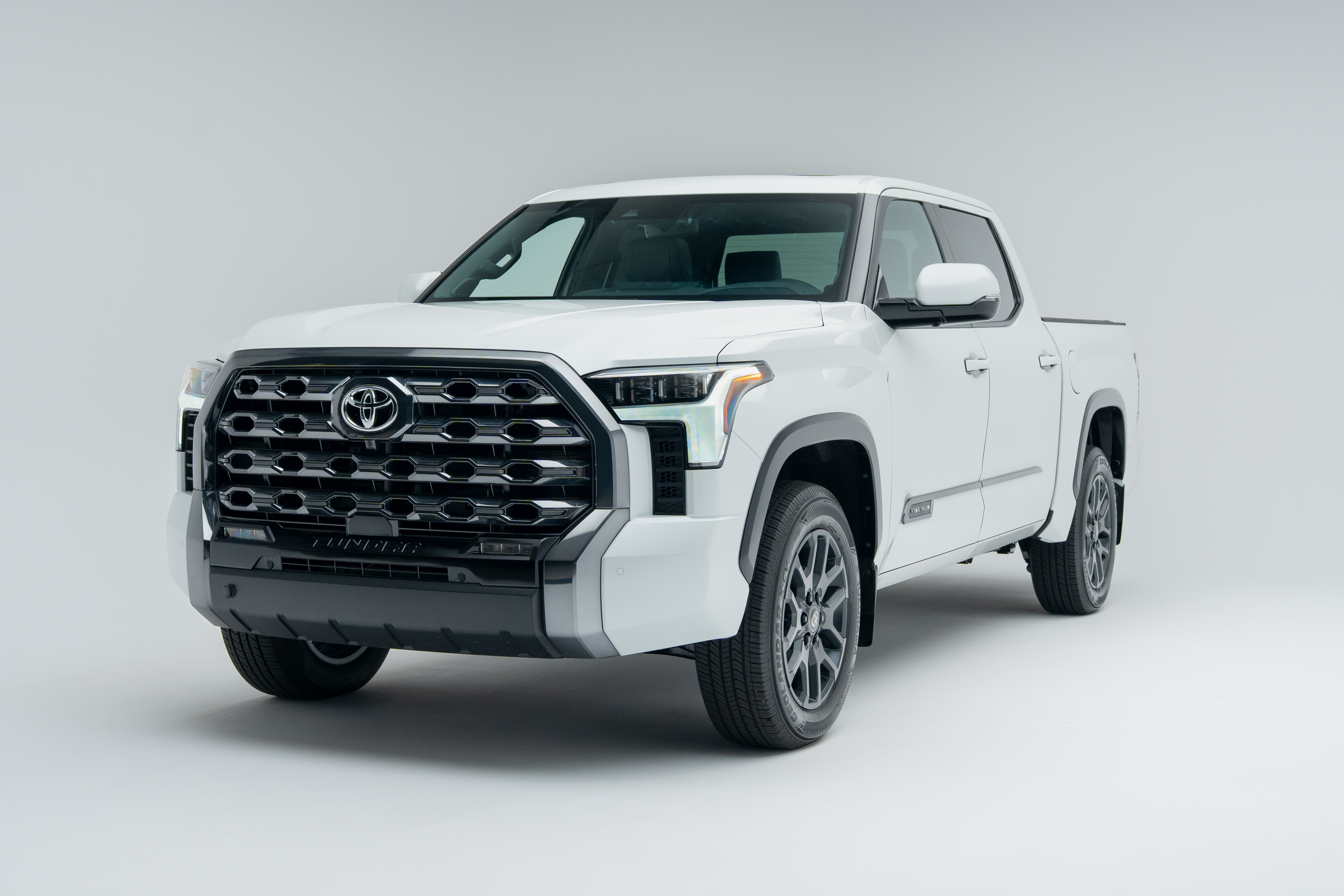 Front three-quarter view of a 2026 Toyota Tundra showing LED headlights, grille, alloy wheels and pickup truck profile.