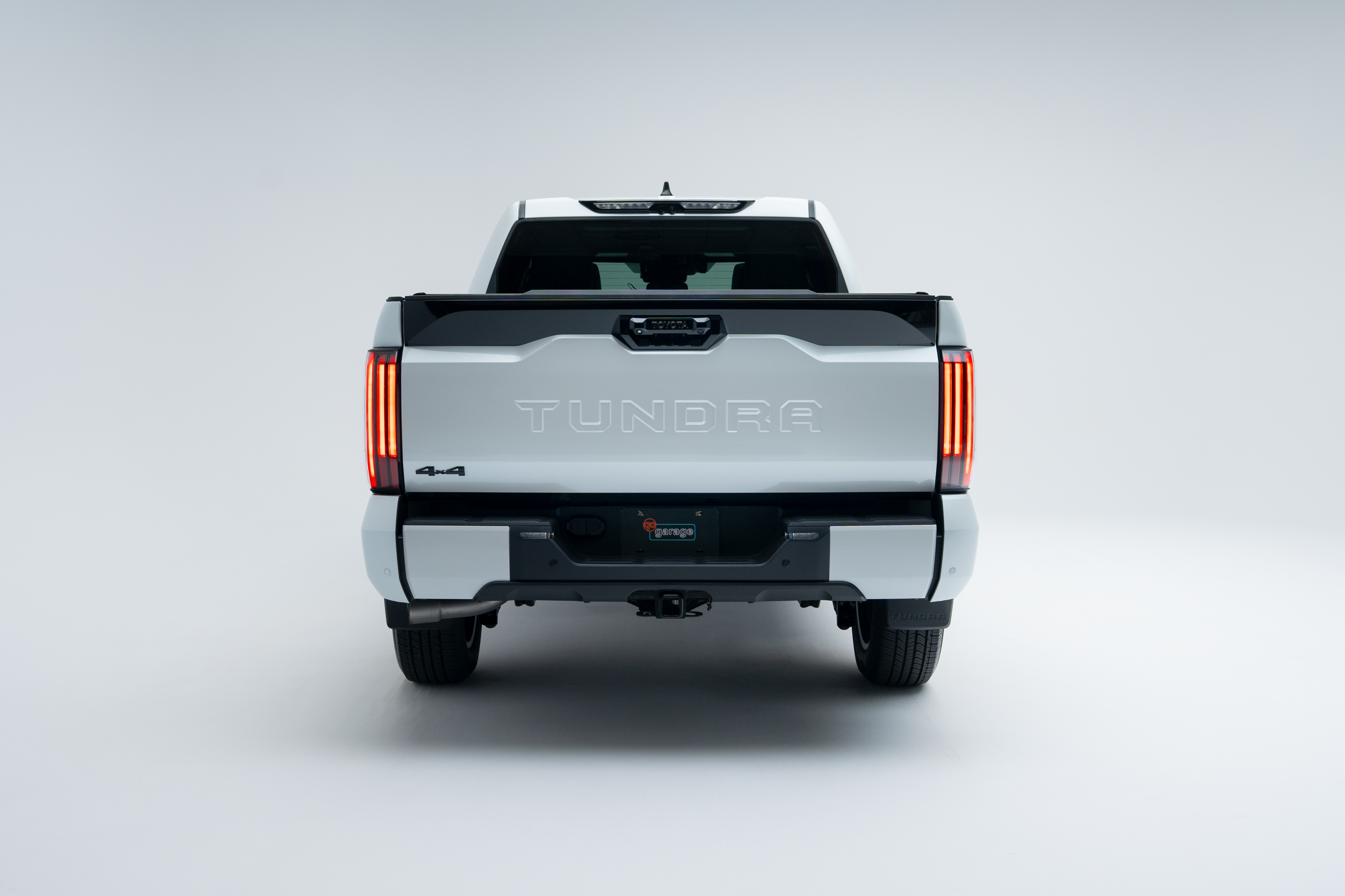 Rear view of a 2026 Toyota Tundra showing taillights, Tundra badging, tailgate and rear bumper.