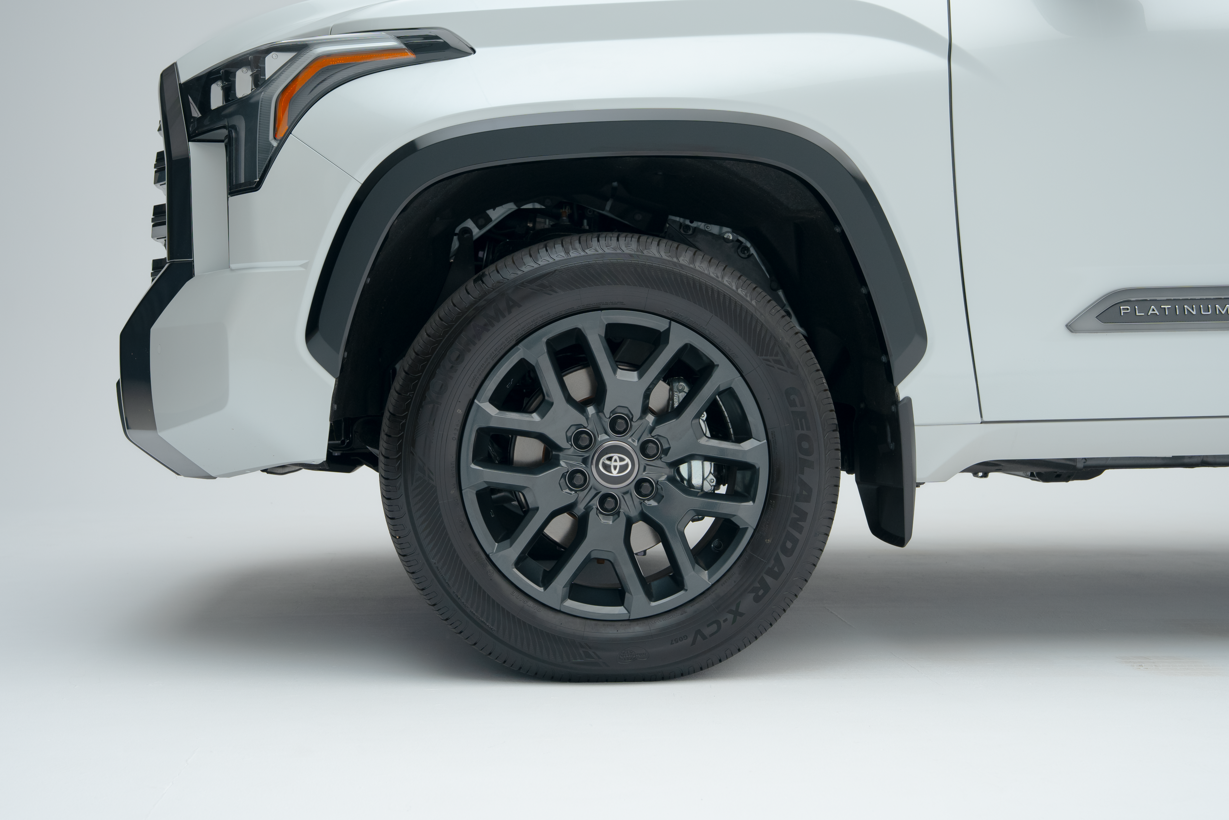 Close-up of a 2026 Toyota Tundra alloy wheel, tire and front fender.