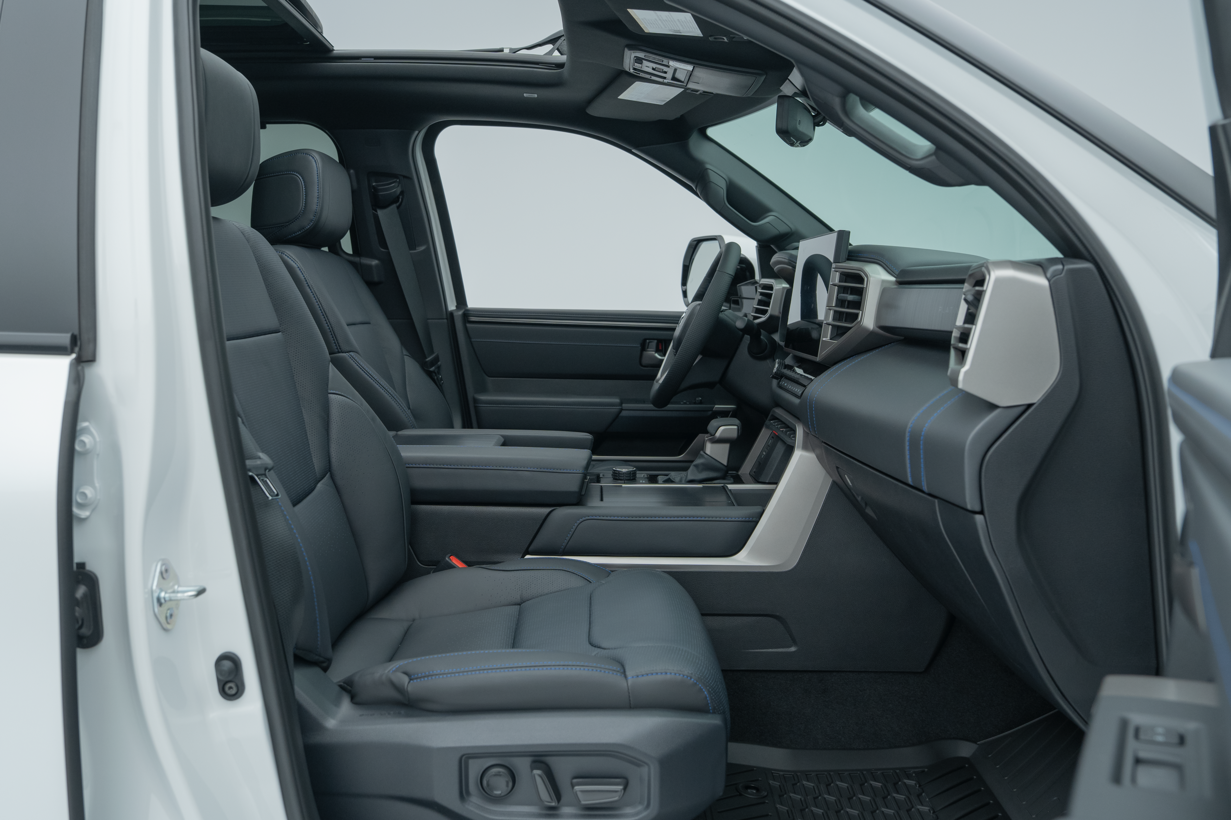 2026 Toyota Tundra front interior with seats, dashboard, centre console and infotainment display.
