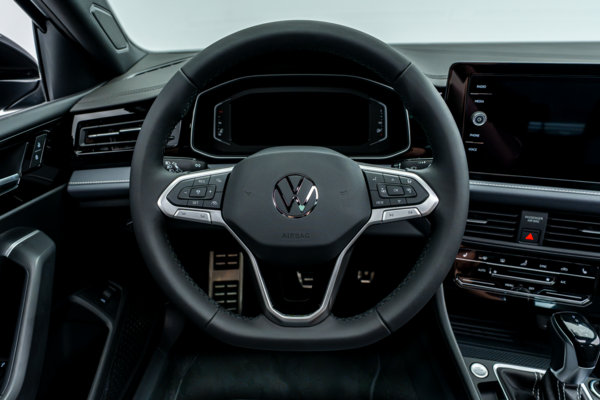 2026 Volkswagen Jetta steering wheel with driver controls, digital instrument cluster and infotainment display.