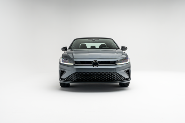2026 Volkswagen Jetta in gray, shown from a front view on a white background.