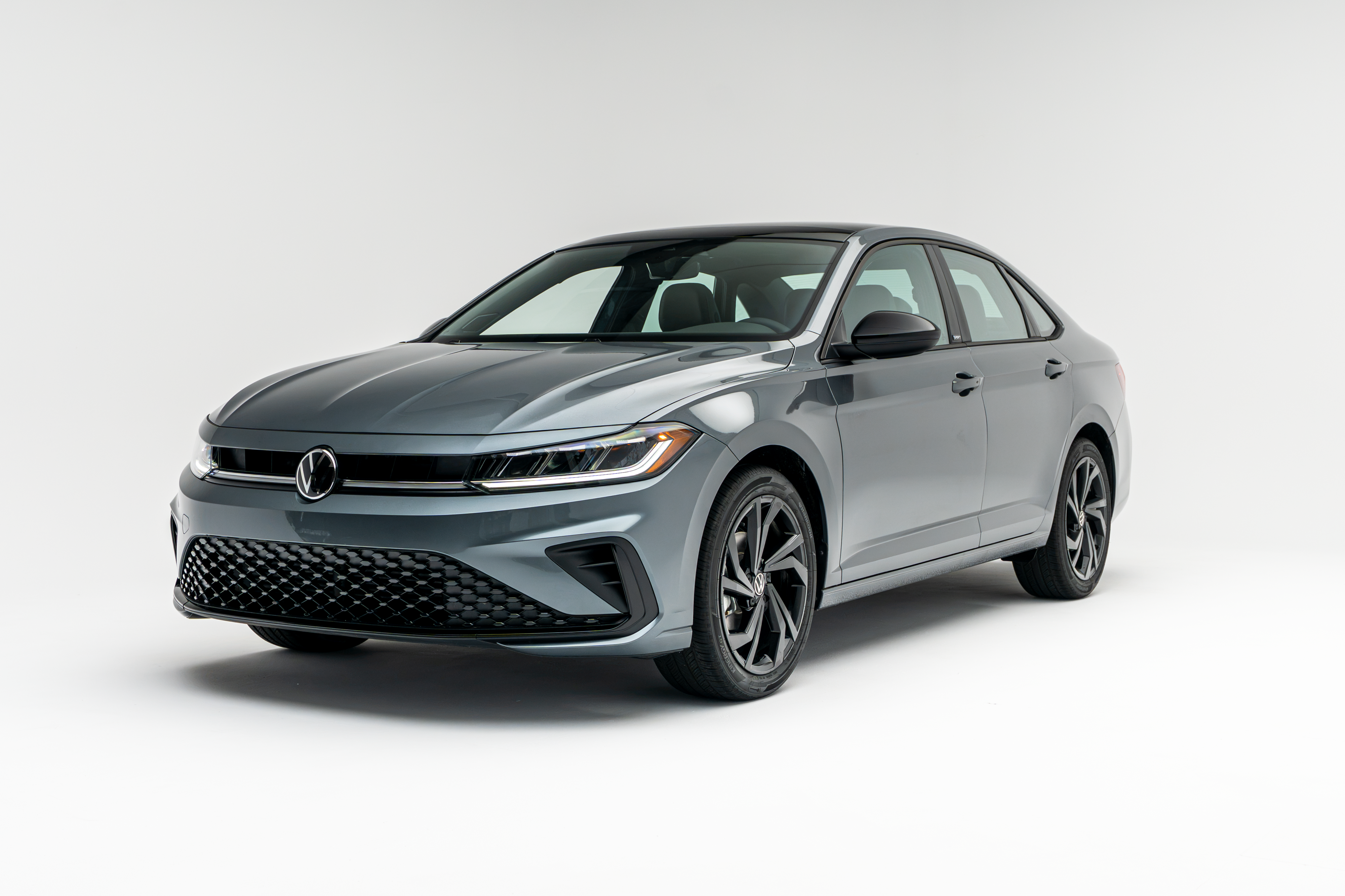 2026 Volkswagen Jetta in gray, shown from a front three-quarter view on a white background.