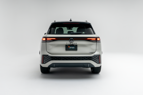 Rear view of a white 2026 Volkswagen Tiguan showing LED taillights, rear bumper and Tiguan badging.