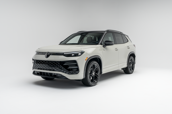 Front three-quarter view of a white 2026 Volkswagen Tiguan SUV with black wheels and trim on a white studio background.